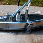 There are many reasons why pros should power wash your business. Here, a surface cleaner is being used to beautify and protect commercial concrete.