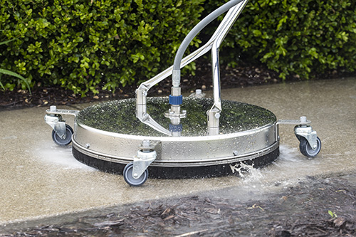 About us: Surface cleaner up close cleaning concrete sidewalk