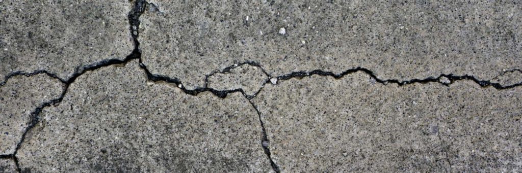 Concrete surface with multiple cracks in it
