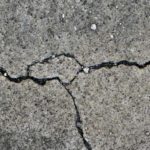 Concrete surface with multiple cracks in it