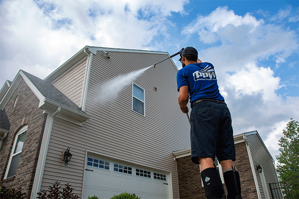 Hydro Savage Pressure Washing technician power washing siding
