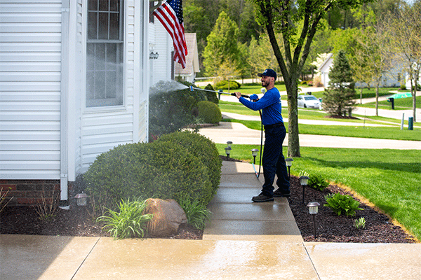 Hydro Savage Pressure Washing employee soft washing siding