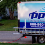 Hydro Savage Pressure Washing Technician Washing a House