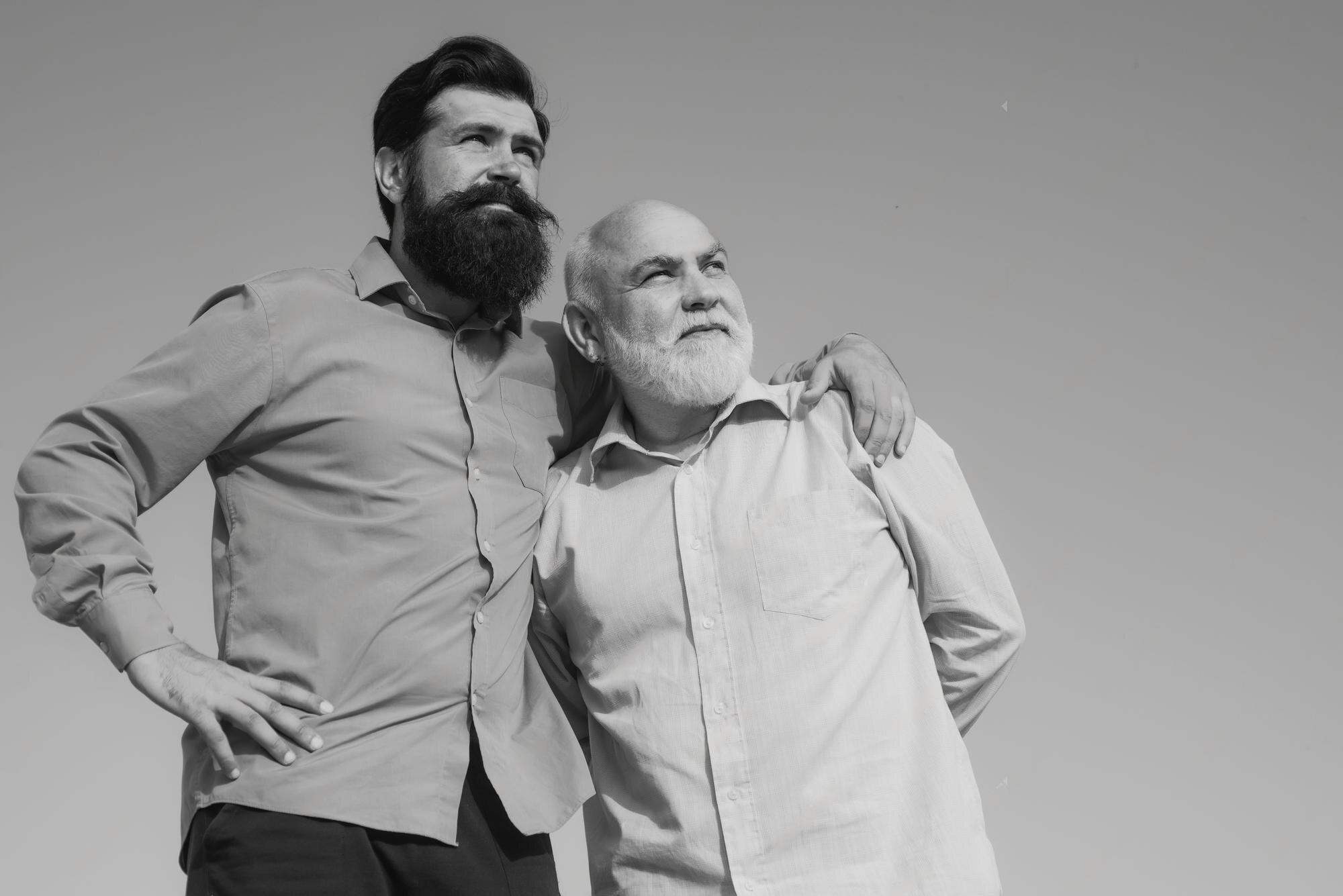 Smiling power washing technician next to satisfied customer discussing the service that was performed